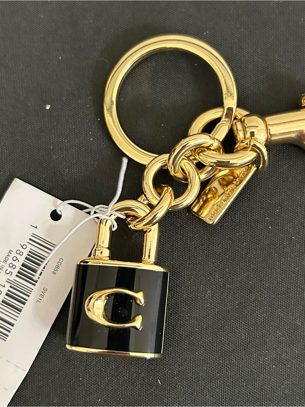 NWT Coach Keychain/Bagcharm Lock and Purple Coach Wristlets EUC with dustbag. - Picture 3 of 6